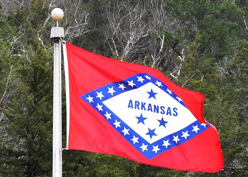 The Arkansas flag is shown in this photo.