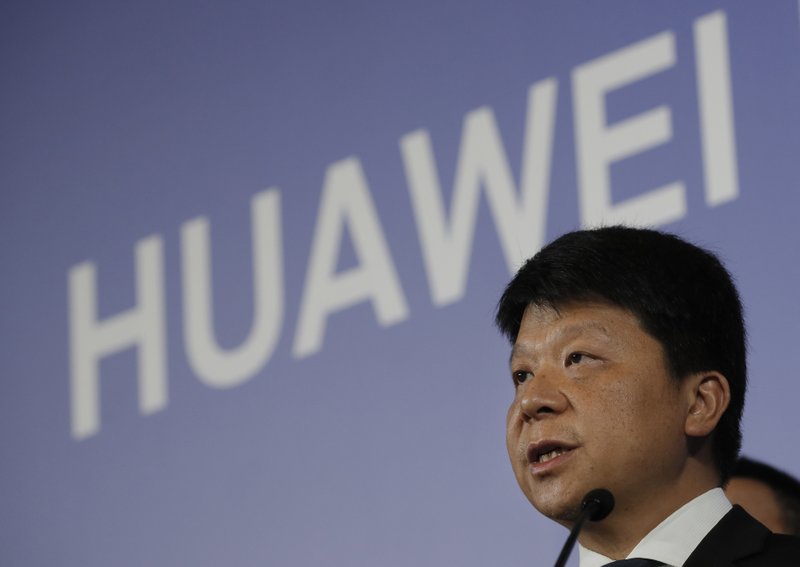 Huawei Rotating Chairman Guo Ping, center, speaks during a press conference in Shenzhen city, China's Guangdong province, Thursday, March 7, 2019. Chinese tech giant Huawei is launching a U.S. court challenge to a law that labels the company a security risk and would limit its access to the American market for telecom equipment. (AP Photo/Kin Cheung)

