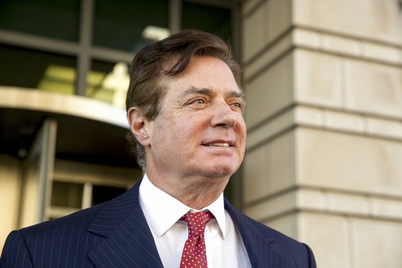 FILE - In this Nov. 2, 2017 file photo, Paul Manafort, President Donald Trump's former campaign chairman, leaves Federal District Court in Washington. The 69-year-old Manafort is scheduled to appear Thursday in U.S. District Court in Alexandria, Virginia, where he could get 20 years under federal guidelines but his lawyers have sought a shorter sentence. Manafort was convicted of hiding from the IRS millions of dollars he earned from his work advising Ukrainian politicians. (AP Photo/Andrew Harnik)