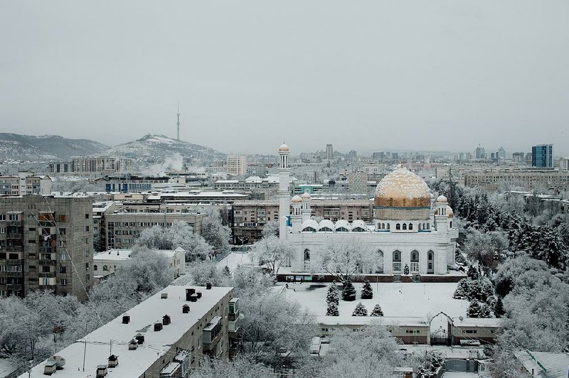 An overview of the center of Almaty with Soviet-era housing blocks and the Central Mosque Almaty (right) are seen in Kazakhstan in January. 