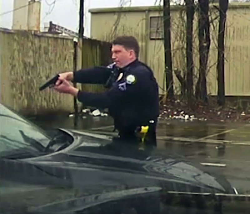 In a series of screen shots from a Little Rock police dashboard-camera video of an officer-involved shooting on Feb. 22, officer Charles Starks fires into the car driven by Bradley Blackshire as the car begins moving, then steps into its path and finally sprawls onto the hood as it continues forward. Blackshire was killed in the shooting. 