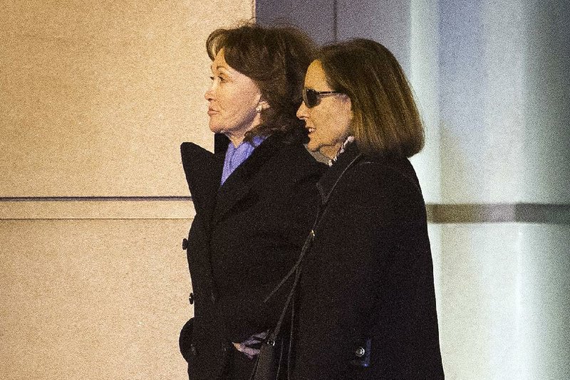 Kathleen Manafort (left), wife of former Trump campaign manager Paul Manafort, leaves the courthouse Thursday in Alexandria, Va., after her husband was sentenced to nearly four years in prison. Manafort, while offering no apology to the judge, said that “the last two years have been the most difficult years for my family and I.” 