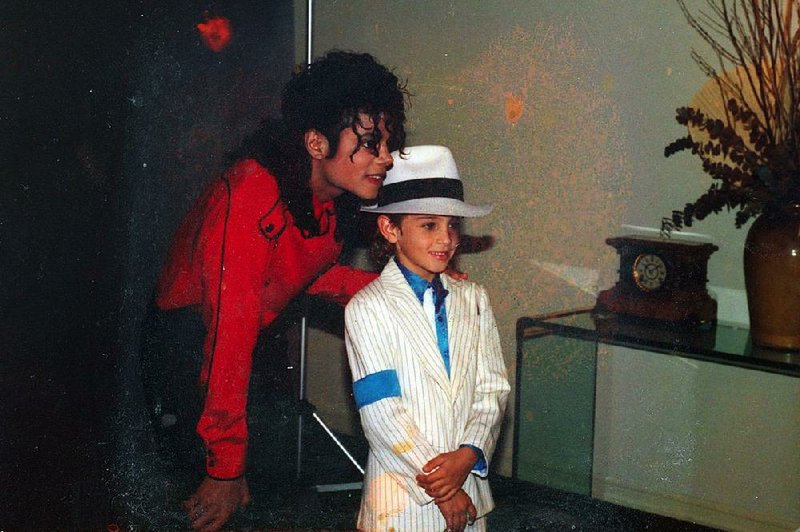 Wade Robson, pictured as a child with Michael Jackson in the 1980s, says in the new HBO documentary Leaving Neverland that Jackson was “one of the kindest, most gentle, loving, caring people I knew … He also sexually abused me for seven years.”
