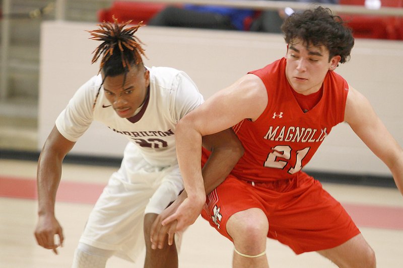 Magnolia junior Kyle Carver battles with a Morrilton Devil Dog during state tournament action. He and the Panthers will face the Little Rock Mills Comets in tonight’s championship game at Hot Springs.