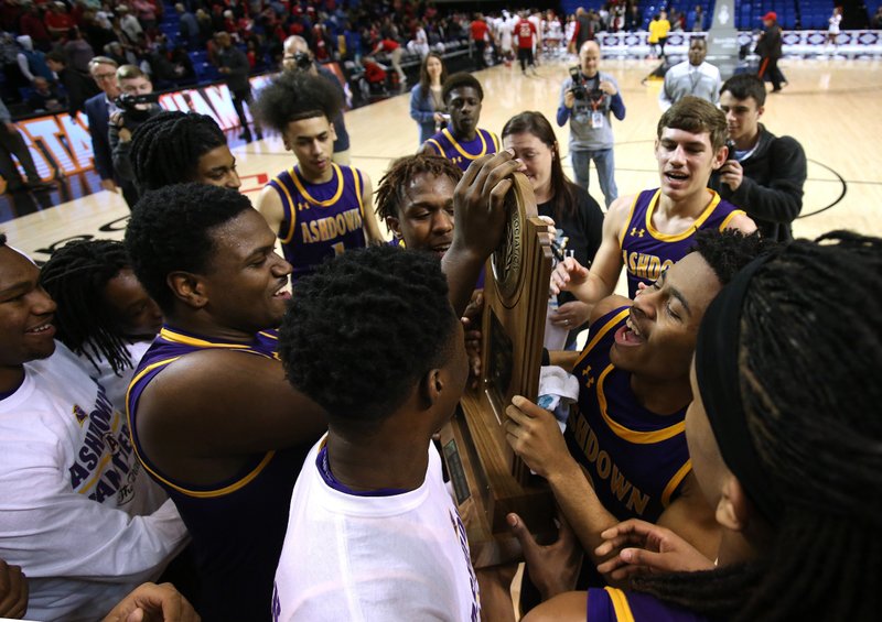 Ashdown players celebrate after the Panthers’ 69-40 victory over Drew Central in the Class 3A boys state basketball championship Thursday at Bank OZK Arena in Hot Springs. More photos available at www.arkansasonline.com/307boys3a/