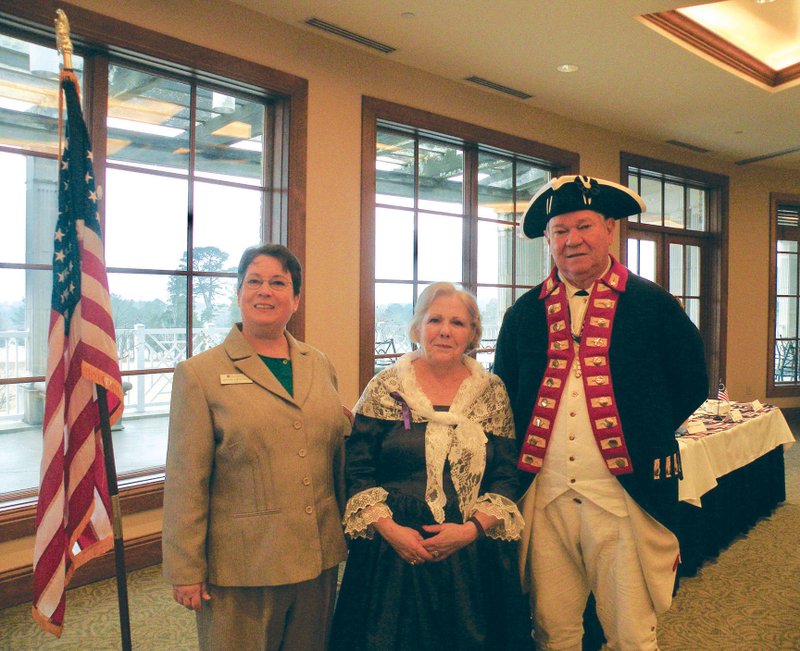 Angela Boswell of Arkadelphia, left, dean of the Matt Locke Ellis College of Arts and Sciences at Henderson State University, spoke at the 15th annual George Washington Birthday Observance at the Hot Springs Country Club. She is shown here with Patricia and Charles McLemore of Mount Ida, who are representing Martha and George Washington. Charles McLemore is president of the DeSoto Trace Chapter, National Society Sons of the American Revolution, and Patricia McLemore is president of the Col. John Washington Chapter, Colonial Dames of XVII Century, and a member of Akansa Chapter, National Society Daughters of the American Revolution.