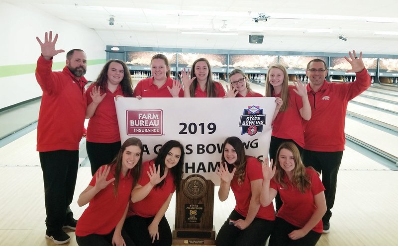 Members of the Cabot Lady Panthers bowling team hold up five, signaling their fifth consecutive state championship. Pictured are, front row, from left, Loretta Turner, Allison Hicks, Emily Trip and Callie Harwood; and back row, head coach Clark Bing, Savannah Mato, Hannah Hawkins, Bethany Taylor, Caitlin Cringle, Jessica Star and assistant coach Corey Imhoff.
