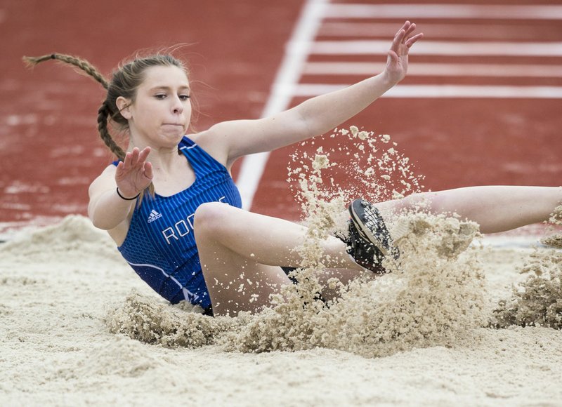 NWA Democrat-Gazette/BEN GOFF @NWABENGOFF Georgia Brain of Rogers competes in the girls triple jump Friday, March 8, 2019, during the Joe Roberts Invitational track meet at Springdale High School. Brain won the event with a jump of 31 feet 6 inches.