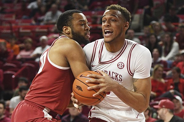 Arkansas forward Daniel Gafford tries to get past Alabama defender Galin Smith during the first half of an NCAA college basketball game, Saturday, March 9, 2019 in Fayetteville. (AP Photo/Michael Woods)

