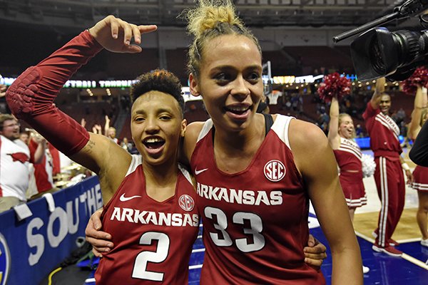 Arkansas' Chelsea Dungee, right, and Alexis Tolefree celebrate after defeating Texas A&M in an NCAA college basketball game in the Southeastern Conference women's tournament Saturday, March 9, 2019, in Greenville, S.C. (AP Photo/Richard Shiro)

