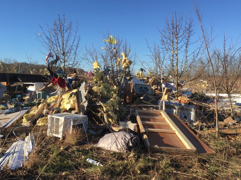Debris from a storm-damaged mobile home is seen Saturday in south Pulaski County.