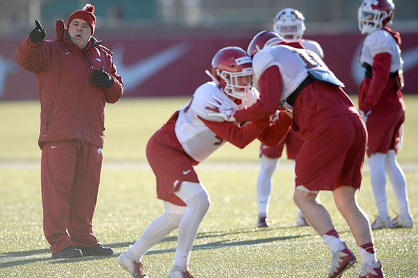 Arkansas defensive coordinator John Chavis watches a drill during practice Tuesday, March 5, 2019, in Fayetteville.