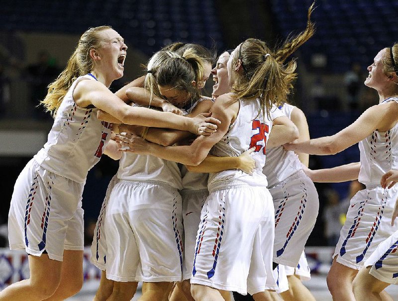 Melbourne players celebrate after the Lady Bearkatz defeated Riverside 48-23 in the Class 2A girls state basketball championship Saturday at Bank OZK Arena in Hot Springs. More photos from this game are available at arkansasonline.com/310girls2a 