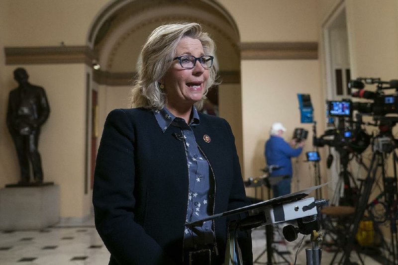 Rep. Liz Cheney speaks during a TV interview Friday at the U.S. Capitol after her vote against the House resolution. Cheney on Sunday accused Democrats of covering up “bigotry and anti-Semitism” by not directly rebuking Rep. Ilhan Omar over her past comments on Israel.