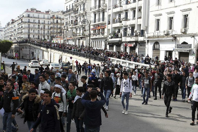 Algerian high school students march Sunday during a protest in the capital, Algiers.
