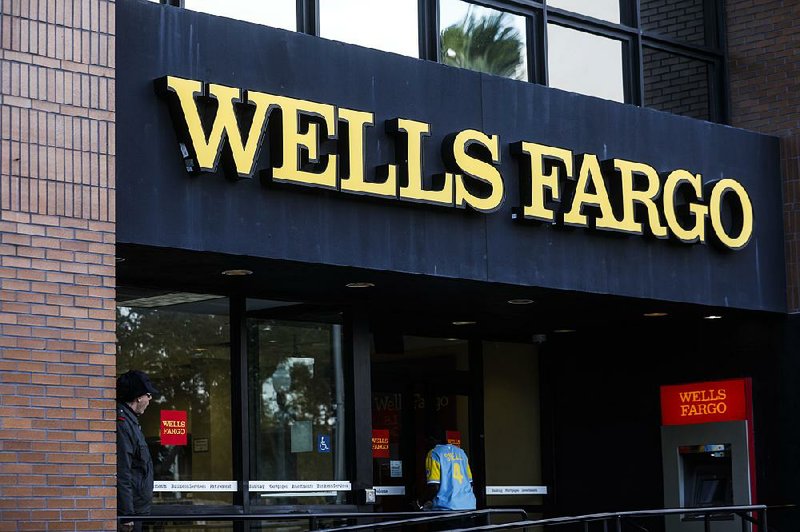 A customer enters a Wells Fargo & Co. bank branch in St. Petersburg, Fla., in January. Wells Fargo Chief Executive Officer Tim Sloan will appear today before a congressional committee examining scandals at the bank. 