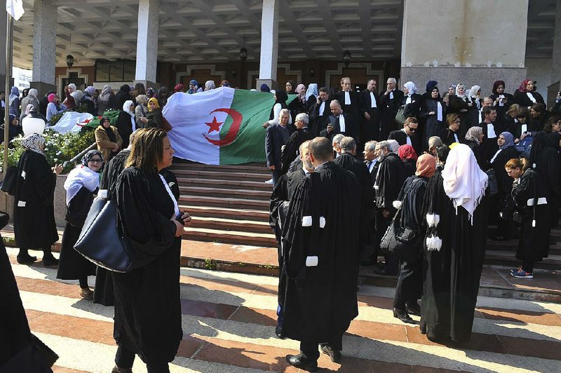 Algerian lawyers gather outside the Algiers courthouse on Monday.