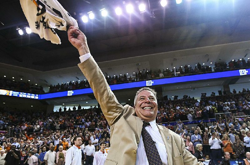 Auburn Coach Bruce Pearl celebrates after the Tigers’ 84-80 victory over Tennessee on Saturday. Auburn has won four in a row and re-entered the AP Top 25 at No. 22 this week.