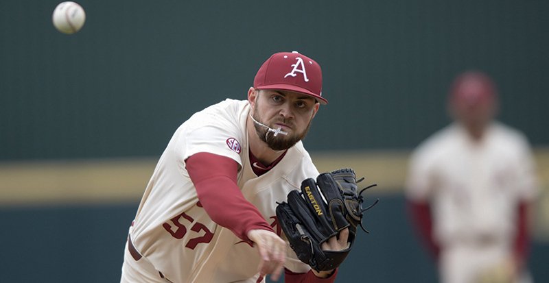 NWA Democrat-Gazette/Charlie Kaijo ALL BETTER: Arkansas Razorbacks Cody Scroggins (57) pitches during Sunday's game against Louisiana Tech at Baum-Walker Stadium in Fayetteville. Scroggins tore a ligament in his elbow two years ago against the Bulldogs, but he led the Razorbacks to an 11-0 win Sunday, striking out a career-high 11 in six innings on the mound.