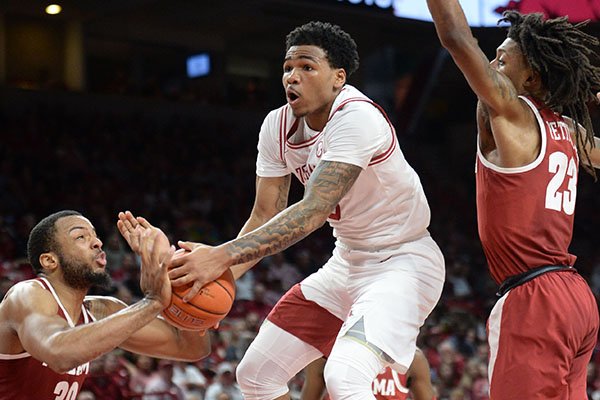 Arkansas guard Desi Sills drives to the basket during a game against Alabama on Saturday, March 9, 2019, in Fayetteville.