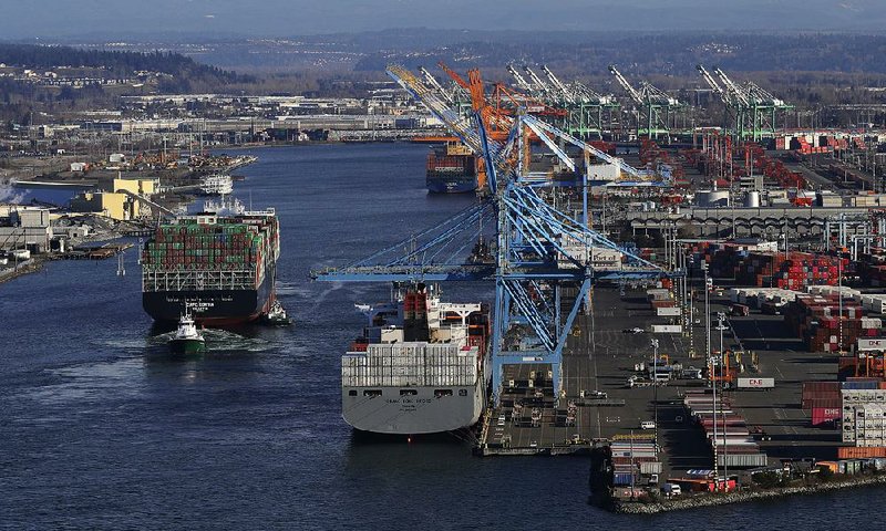 A container ship heads into the Port of Tacoma, Wash., last week U.S. Trade Representative Robert Lighthizer said Tuesday of U.S. and Chinese trade negotiations, “We’re working more or less continuously.” 