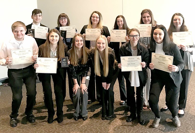 Submitted Photo Members of the Gravette chapter of Future Business Leaders of America display the award certificates they won in district competition at Fayetteville in January. All these district winners are now qualified for state competition in Little Rock. Pictured are Keaton Oyler (front row, left), Peyton Stearman, Keeley Bulza, Brynn Hilger, Tanner Stearman, Malia Johnson, Kade Jarvis (back row, left), Amy Whiteside, Kristen Partain, Alexis Gerner, Julia Matteson and Keeli Moore.