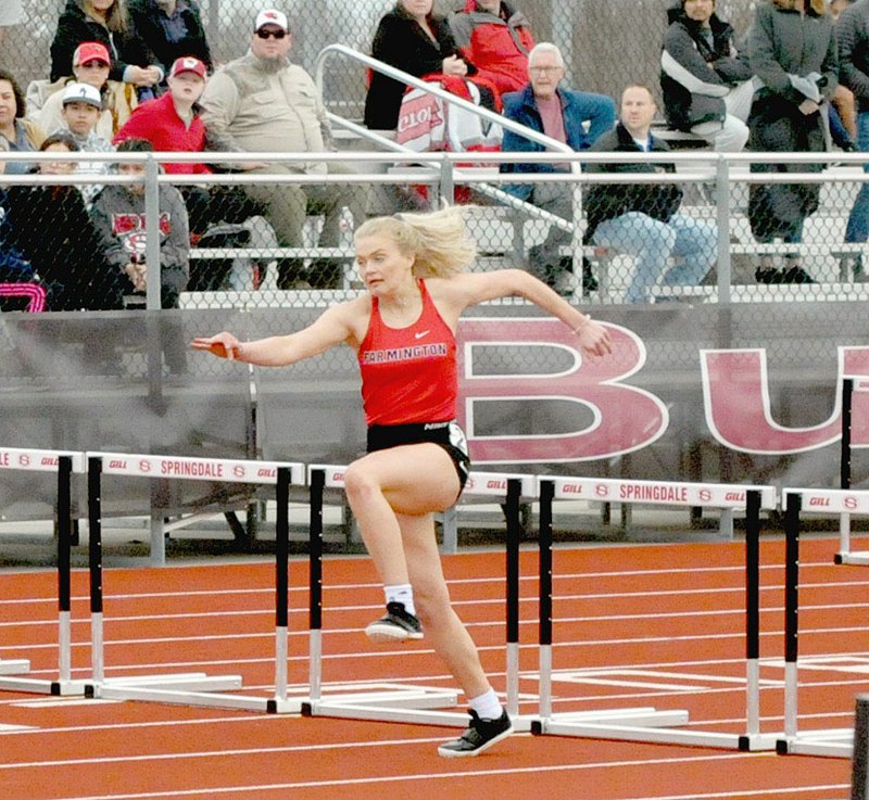 MARK HUMPHREY ENTERPRISE-LEADER/Farmington's Addison Fenton competes in hurdles Friday at the Springdale Relays.