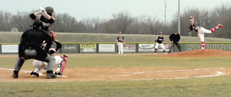 MARK HUMPHREY ENTERPRISE-LEADER/Farmington junior Drew Sturgeon pitches against Springdale. The Cardinals lost 8-2 Friday at Randall Tyson Recreation Complex.