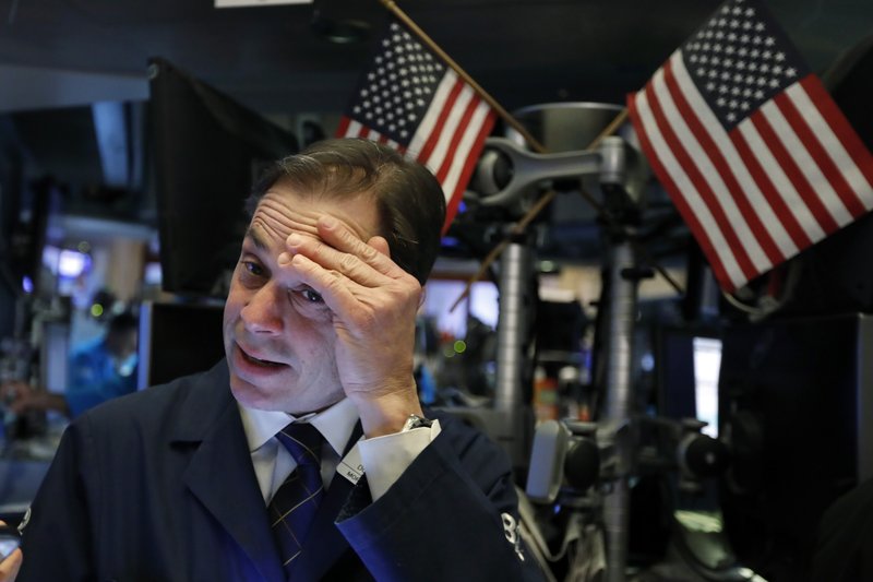 Trader Dudley Devine works on the floor of the New York Stock Exchange, Tuesday, March 12, 2019. Another slide in Boeing weighed on the Dow Jones Industrial Average. (AP Photo/Richard Drew)