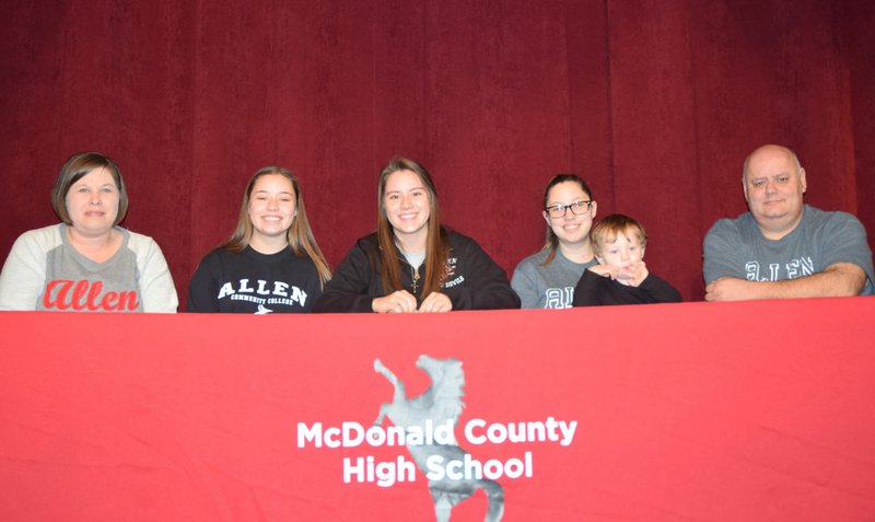 RICK PECK/SPECIAL TO MCDONALD COUNTY PRESS Kaylee Cornell (center) recently signed a letter of intent to play softball at Allen County Community College in Iola, Kan. From left to right: Mom, (Sheila), sister (Kristen), Kaylee, sister (Kourtney), nephew (Damian) and Dad (Randy).