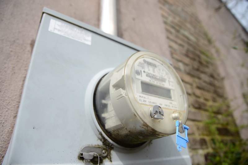 FILE — A current Entergy meter sits on the side of a downtown Magnolia building.