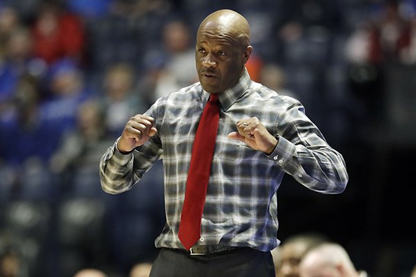 Arkansas head coach Mike Anderson signals to his players in the second half of an NCAA college basketball game against Florida at the Southeastern Conference tournament Thursday, March 14, 2019, in Nashville, Tenn. Florida won 66-50. (AP Photo/Mark Humphrey)