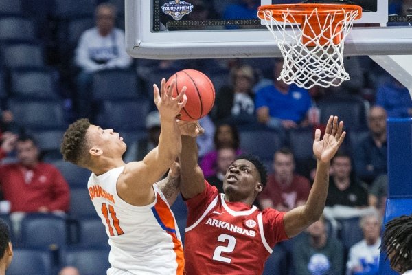 Adrio Bailey (2), Arkansas forward, defends as Keyontae Johnson, Florida forward, shoots in the second half Thursday, March 14, 2019, during the second round game in the SEC Tournament at Bridgestone Arena in Nashville.