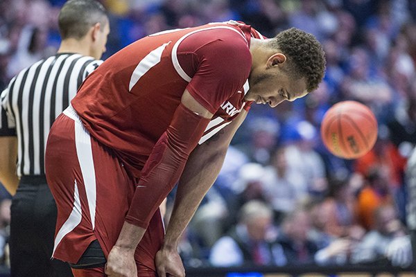 Arkansas center Daniel Gafford hangs his head late during the Razorbacks' SEC Tournament loss to Florida on Thursday, March 14, 2019, in Nashville, Tenn.