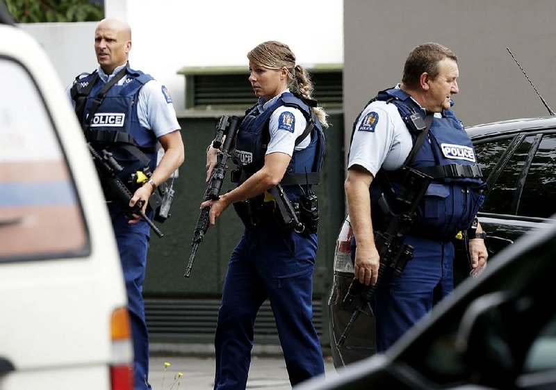 Police officers patrol today outside a mosque in central Christchurch, New Zealand, one of two where at least one gunman opened fire. Residents of the area were warned to stay indoors. 