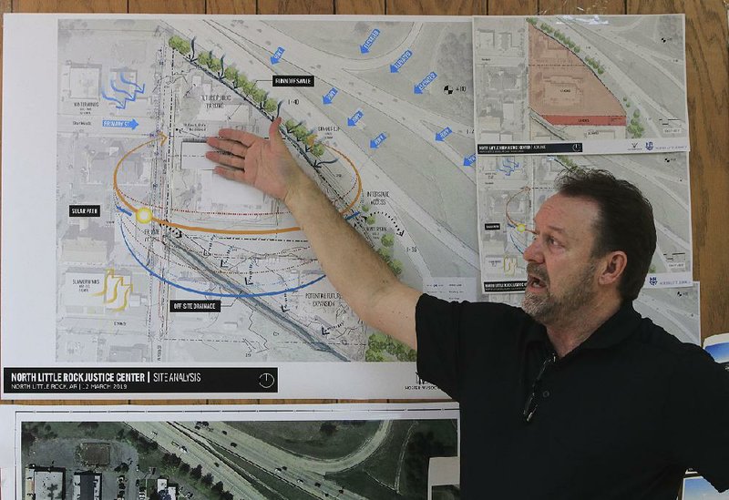 Architect Ken Henton with Hoefer Wysocki in Leawood, Kan., talks about the site for the new North Little Rock police and courts building during a meeting Thursday with city officials. 