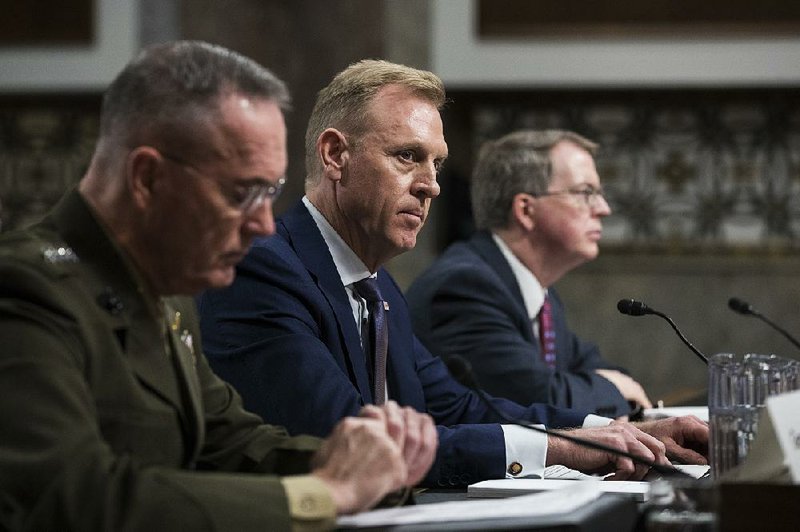 Acting Defense Secretary Patrick Shanahan (center), testifies Thursday in a Senate Armed Services Committee hearing along with Gen. Joseph Dunford (left), chairman of the Joint Chiefs of Staff, and David Norquist, chief financial officer for the Defense Department. 