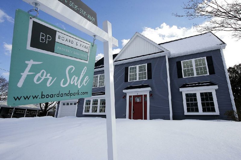 Sales of new U.S. homes like this one in Natick, Mass., fell to an annualized rate of 607,000 in January. Homebuying declined in the Northeast, Midwest and South but rose in the West. 