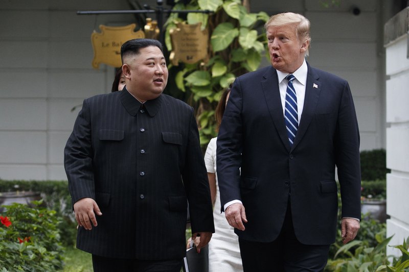 FILE - In this Feb. 28, 2019 file photo, President Donald Trump and North Korean leader Kim Jong Un take a walk after their first meeting at the Sofitel Legend Metropole Hanoi hotel, in Hanoi.