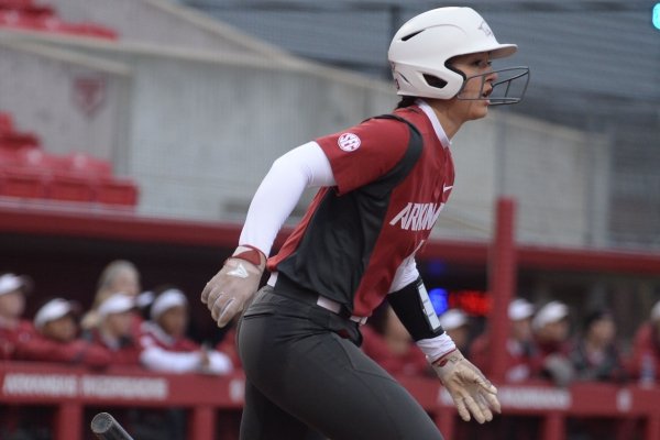 Arkansas catcher Kayla Green connects to score a run against Southeast Missouri Thursday, Feb. 21, 2019, during the first inning at Bogle Park on the university campus in Fayetteville.