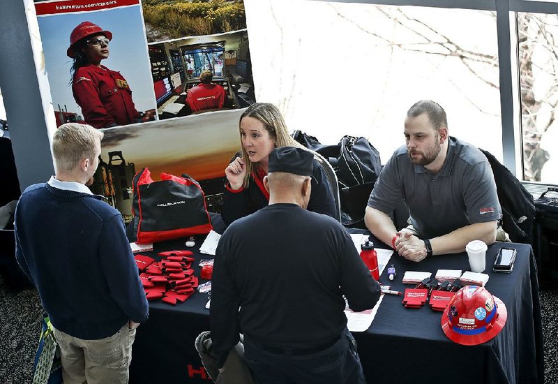 Visitors to a veterans’ job fair meet with recruiters at Heinz Field in Pittsburgh recently. U.S. job openings in January increased to 7.6 million. 