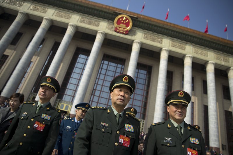 In this March 4 photo, military delegates leave after a meeting one day before the opening session of China's National People's Congress (NPC) at the Great Hall of the People in Beijing. To a remarkable degree, the Pentagon’s new budget proposal is shaped by national security threats that Acting Defense Secretary Patrick Shanahan has summarized in three words: “China, China, China.” (AP Photo/Mark Schiefelbein)

