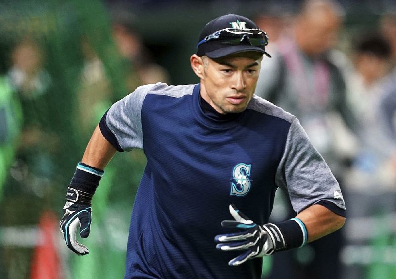 Seattle Mariners outfielder Ichiro Suzuki takes part in a practice with the team at the Tokyo Dome on Saturday. Suzuki is back in his native Japan this week, where the Mariners will open the season against the Oakland Athletics on Wednesday and Thursday.