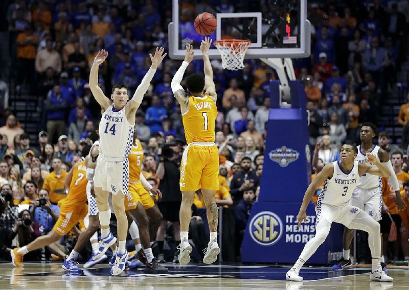 Tennessee guard Lamonte Turner (right) shoots a three-pointer to give No. 8 Tennessee a 78-76 lead with 31 seconds left in an SEC Tournament semifinal against No. 4 Kentucky on Saturday in Nashville, Tenn. The Vols held on to win 82-78.