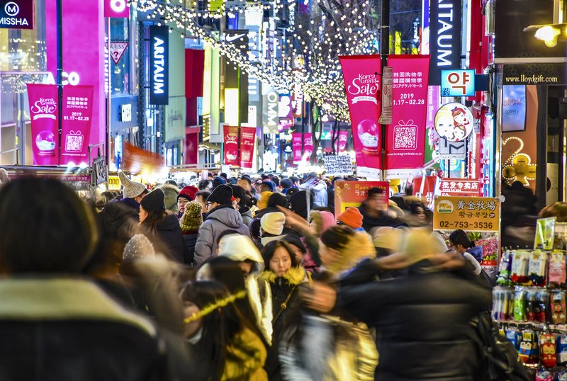 Lights, colors and crowds make Seoul's Myeong-dong district a thriving, buzzing spot for eating, shopping and people-watching. Photo by Christopher Reynolds via Los Angeles Times/TNS)