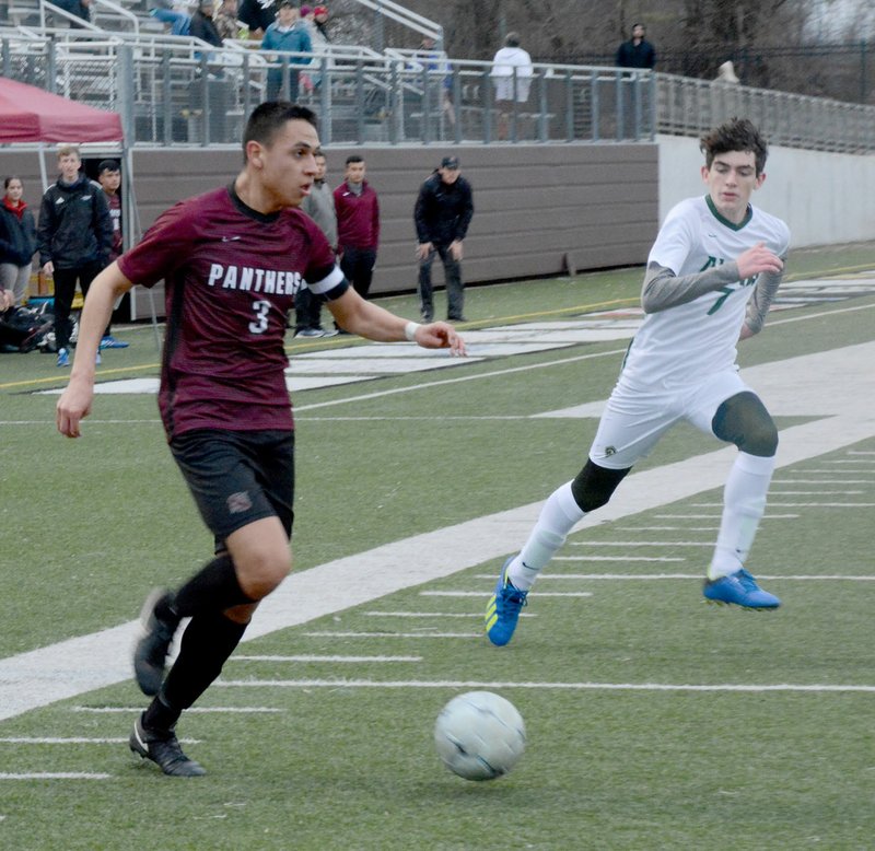 Graham Thomas/Siloam Sunday Siloam Springs senior Christian Marroquin dribbles the ball against Alma during Tuesday's game against the Airedales at Panther Stadium. Marroquin had two assists as the Panthers defeated the Airedales 7-0.