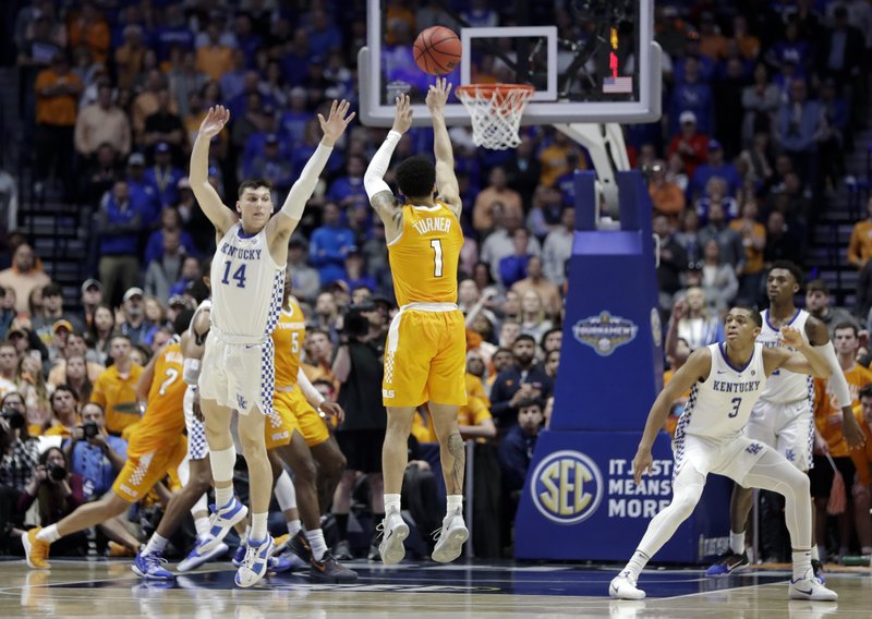 The Associated Press FINAL MINUTE: Tennessee guard Lamonte Turner (1) shoots a 3-point shot against Kentucky to give Tennessee a 78-76 lead in the final minute of an NCAA college basketball game at the Southeastern Conference tournament Saturday, in Nashville, Tenn. Tennessee held on to win 82-78.