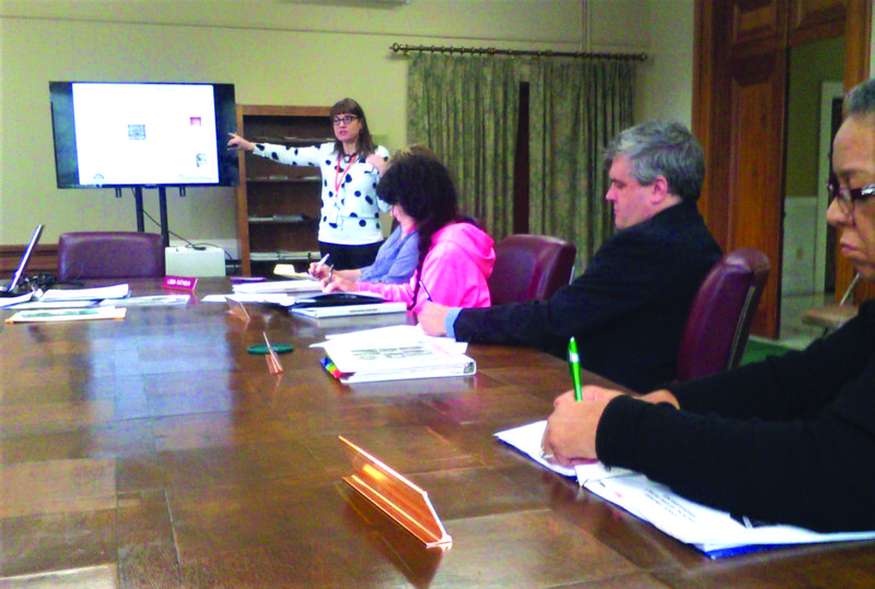 Presentation: Catherine Barrier, certified local government coordinator with the Arkansas Historic Preservation Program, makes a presentation to the El Dorado Historic District Commission. Commissioners are, Carolyn Ellison, foreground, Ken Bridges, Vice Chairman Teresa Golliher and Chairman Linda Rathbun.