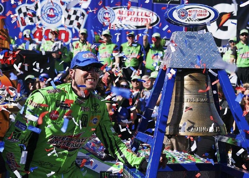 Kyle Busch celebrates after winning Sunday’s NASCAR Cup Series race at Auto Club Speedway, in Fontana, Calif. It was the 200th victory across NASCAR’s three major series for Busch.