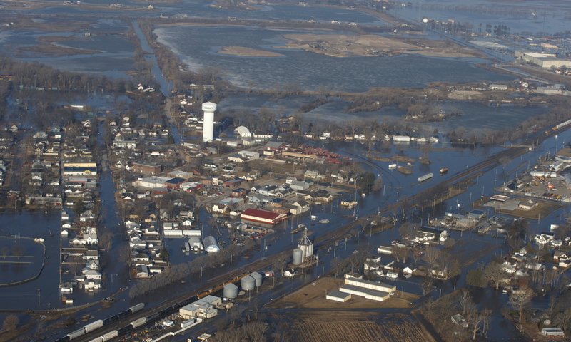 The city of Valley is inundated with floodwaters Sunday, March 17, 2019, in Valley, Neb. Hundreds of people were evacuated from their homes in Nebraska and Iowa as levees succumbed to the rush of water. (Jeff Bundy/Omaha World-Herald via AP)

